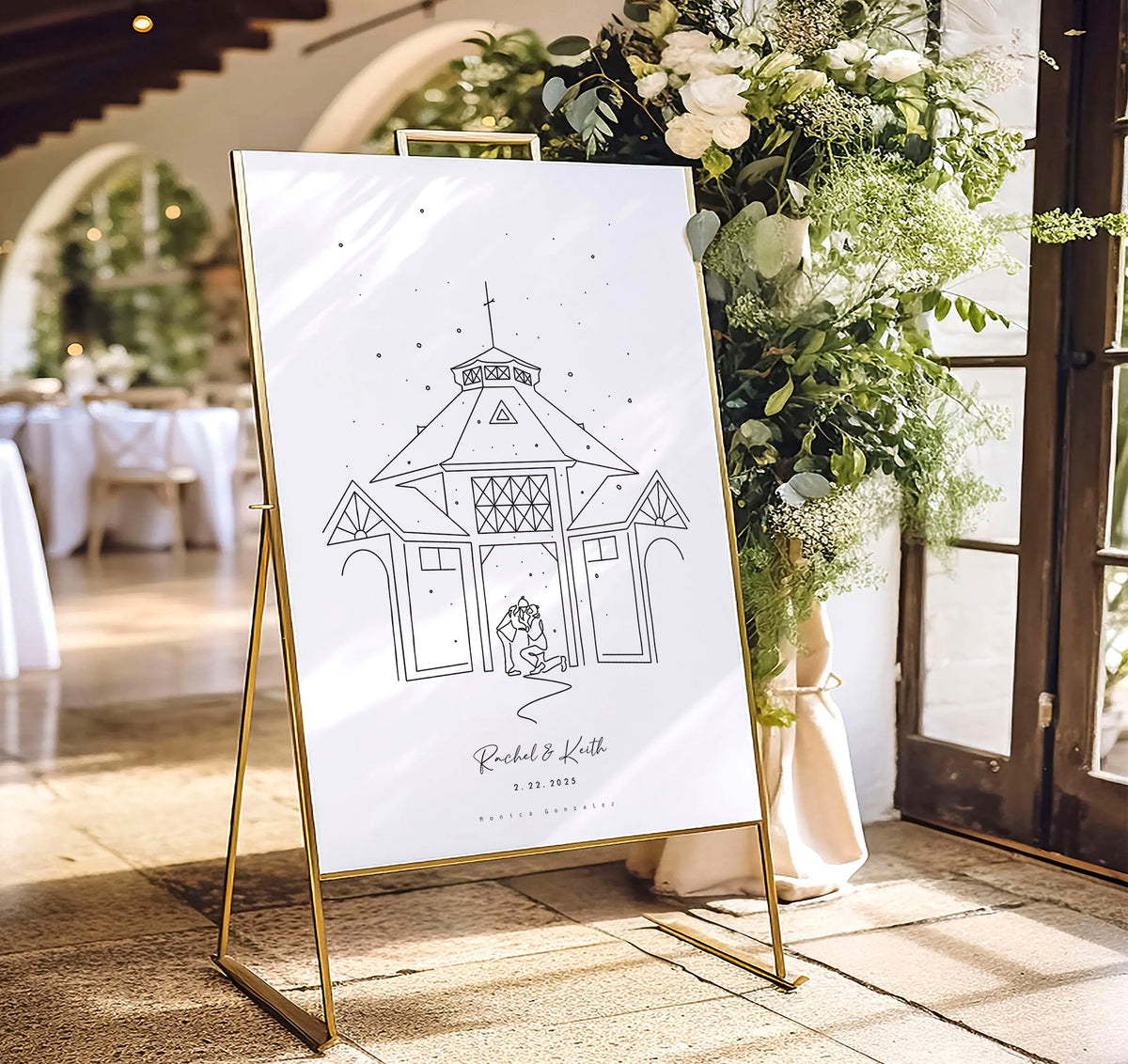 Decorative sign with a personalised line art illustration of a couple in front of the location where they got engaged on a stand, surrounded by flowers and tables in a room, ready for their wedding day ceremony